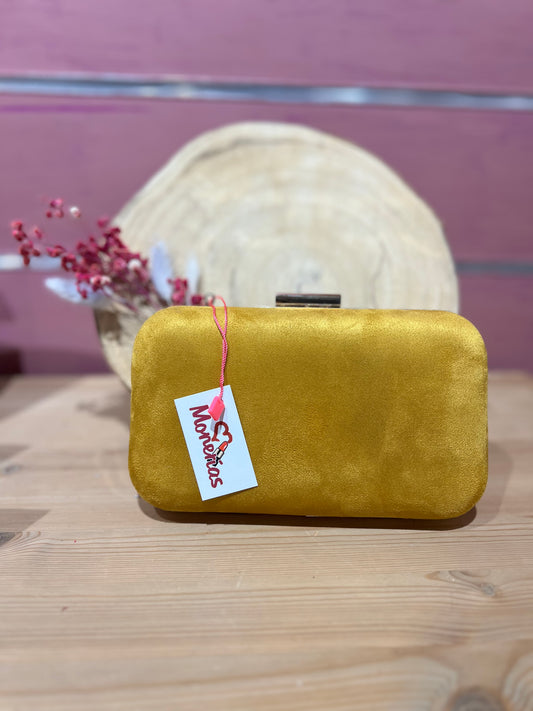 Clutch mostaza redondo.